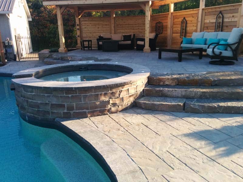 hot tub attached to pool