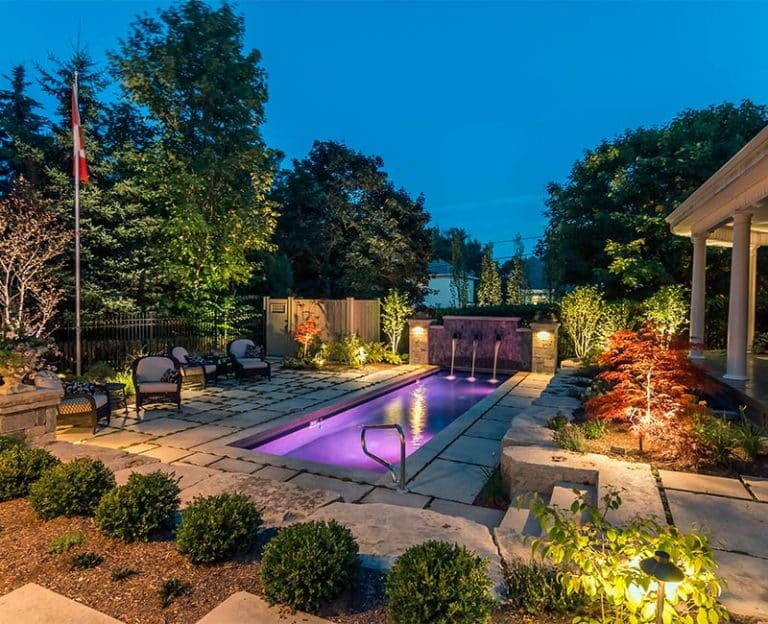 rectangle pool at night | St. Lawrence Pools, Hot Tubs, Fitness, Billiards & Patio