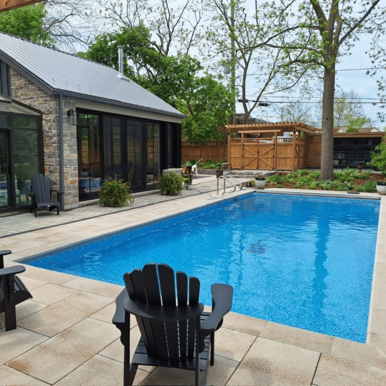 In ground pool with Adirondack chair
